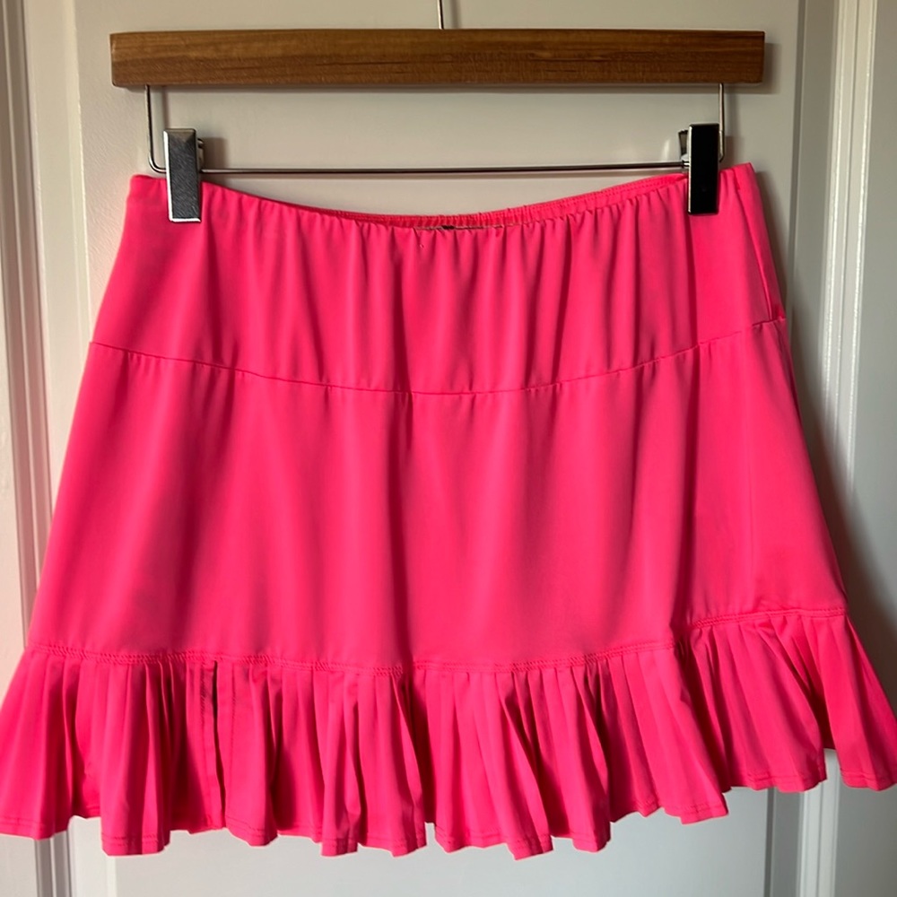 Hot pink women’s tennis skirt.